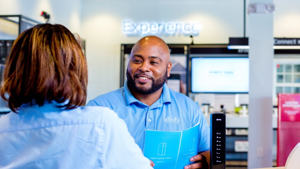 Xfinity store employee speaking to customer