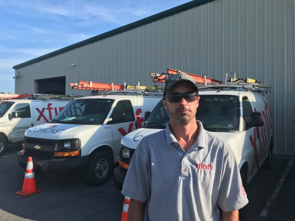 Man in front of his truck