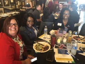 Comcast employees sitting at a table together