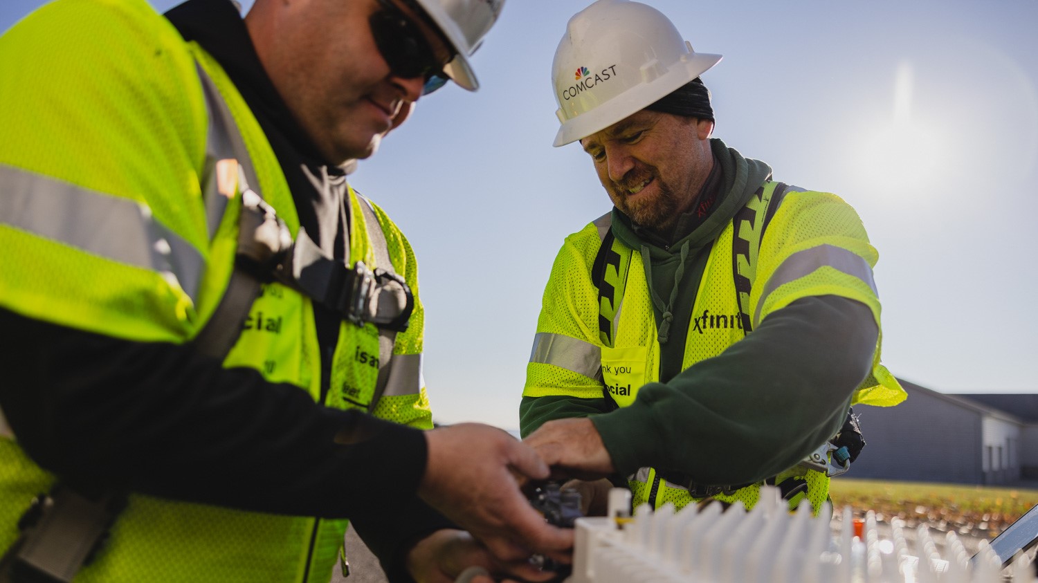 Two techs working in the field