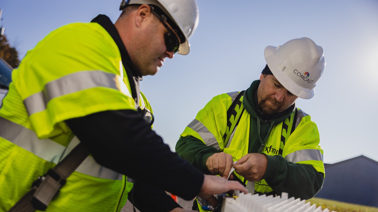 Two technicians working in the field